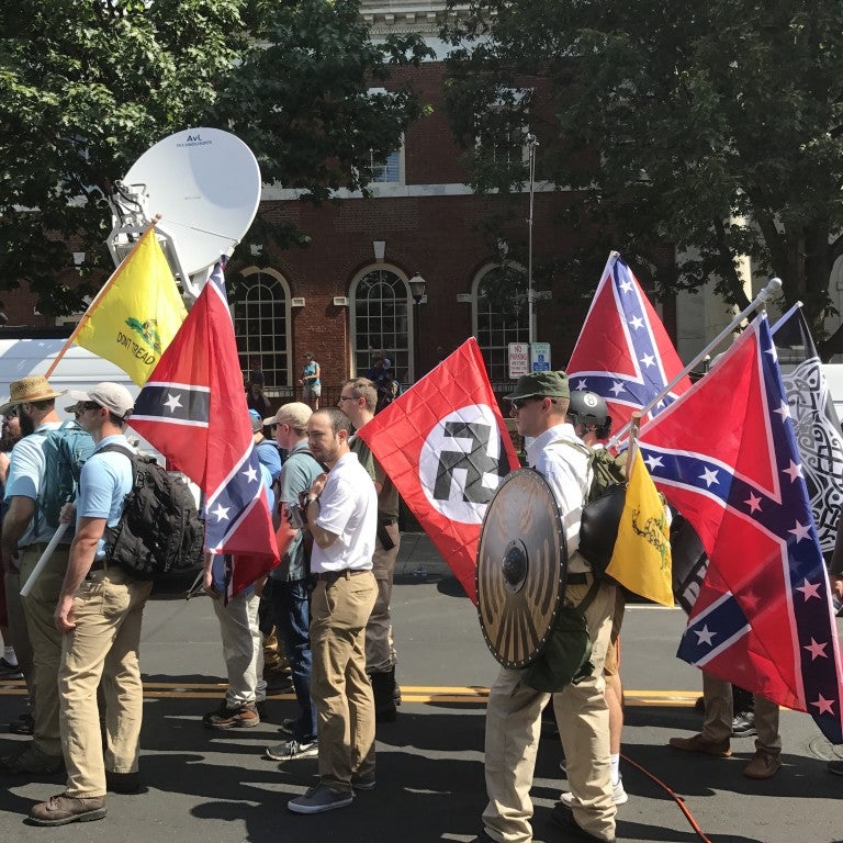 Image of people holding Nazi flags during a white supremacist rally in Charlottesville