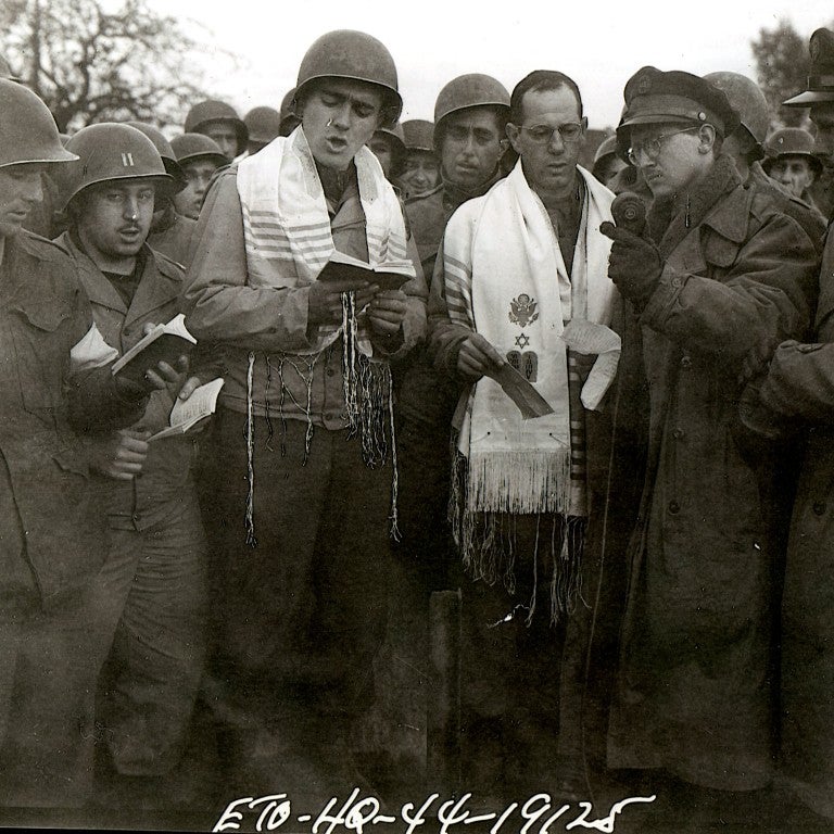  Chaplain Sidney Lefkowitz, PFC Max Fuchs, acting cantor, and soldiers in 1944 for NBC Radio Broadcast at Aachen, Germany battlefield