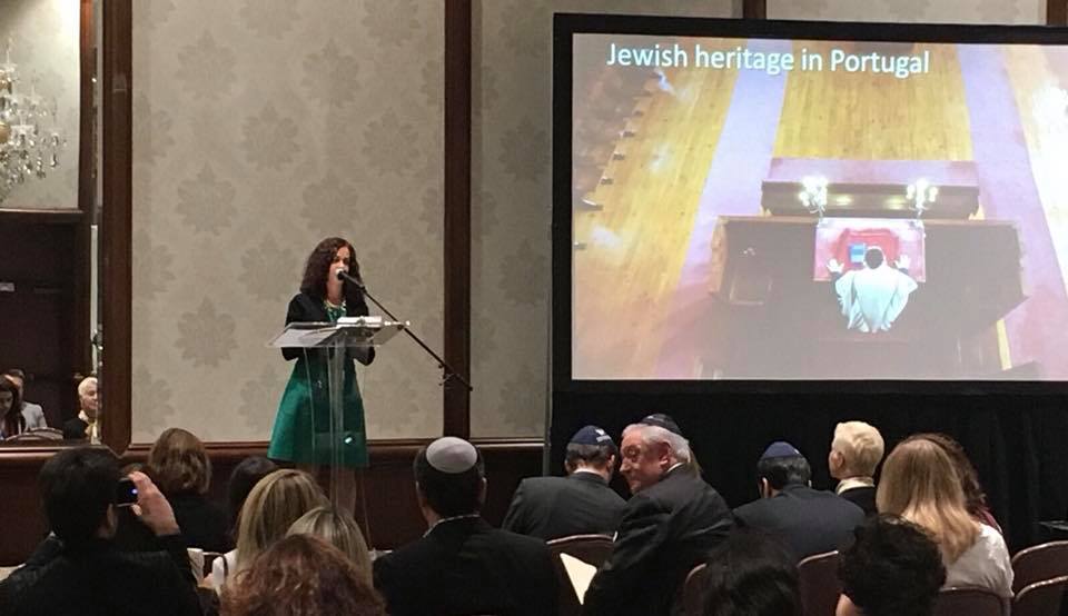 Photo of speaker at Sephardic Temple Tifereth Israel discussing Jewish heritage in Portugal.