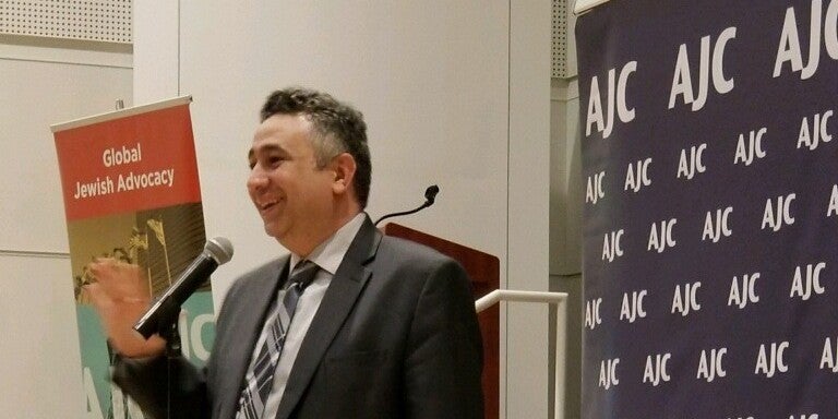 Photo of Shadi Martini speaking at AJC Seattle event