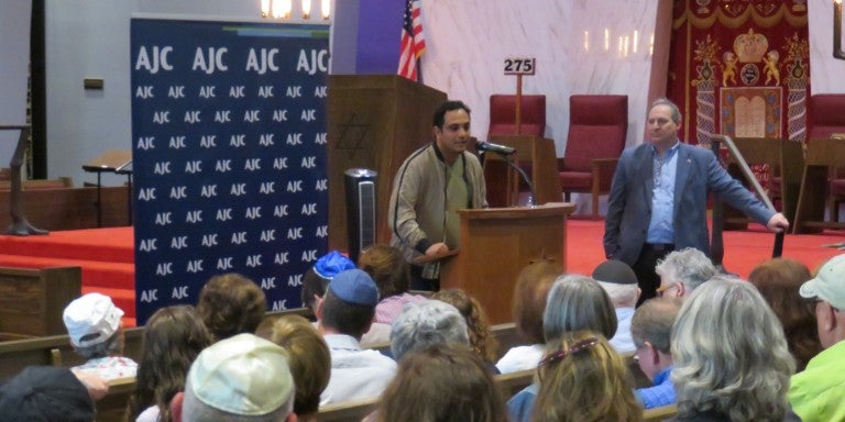 Photo of Mohammed Al Samawi speaking at AJC Seattle event