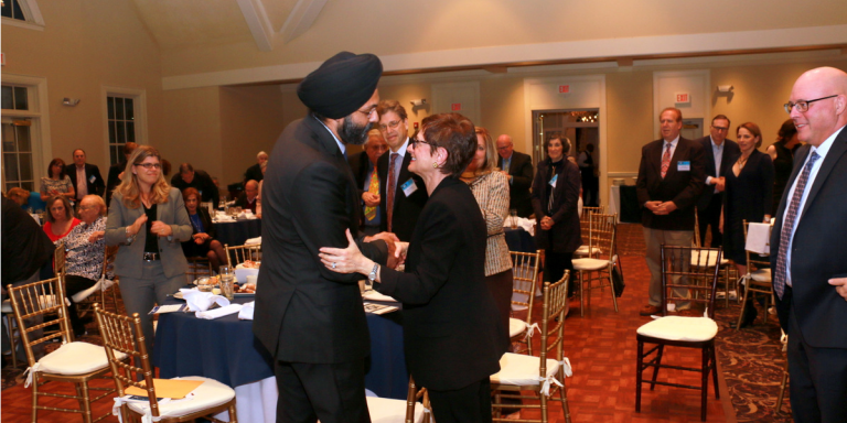 AG Grewal shaking hands with AJC Metro New Jersey's Board President, Genesia Perlmutter Kamen at AJC New Jersey Metro Annual Meeting and Dinner 