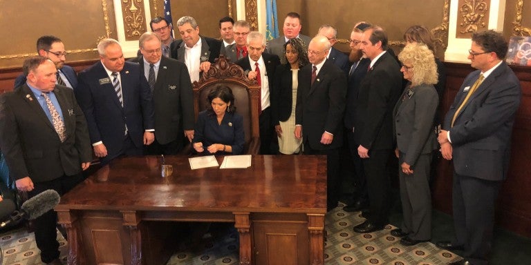 Photo of Governor Noem signing BDS legislation.