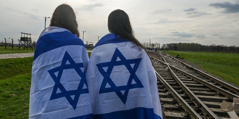 March Of The Living 2023: Thousands Marching From Auschwitz To Birkenau OSWIECIM, POLAND - APRIL 18, 2023: Participants during the 35th annual 'March of the Living' between Auschwitz and Birkenau camps, the largest German Nazi-operated concentration camp during World War II, on April 18, 2023, in Oswiecim, Poland. The March of the Living, an annual educational program, brings together Jewish students from around the world to silently march from Auschwitz I to Auschwitz II Birkenau, paying tribute to the mil