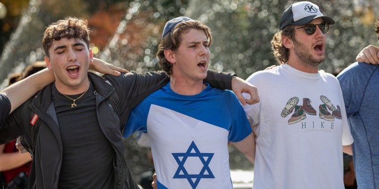 Pro-Israel counter-protesters sing arm-in-arm during a rally as students call for a ceasefire in Gaza Planned walkouts by students on college campuses across the country were organized calling for an end to the retaliation bombing of Gaza after the Palestinian militant group launched a deadly attack in southern Israel on October 7.