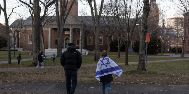 People attend a menorah lighting ceremony on the seventh night of Hanukkah with Harvard's Jewish community on December 13, 2023, in Harvard Yard, Cambridge, Massachusetts. The campus had been in turmoil over divided opinions about Israel's war in the Gaza Strip, with the Jewish community saying they do not feel supported or protected by the university.