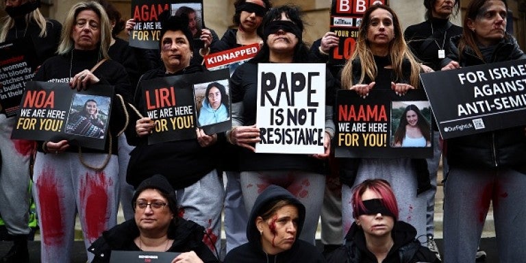 Protesters wearing fake blood make-up and holding placards take part in a demonstration "Rape is NOT resistance" outside the BBC headquarters, in London, on February 4, 2024 to bring attention to the plight of the kidnapped Israeli women in Gaza who have been held by Hamas for over 110 days. Thousands of civilians, both Palestinians and Israelis, have died since October 7, 2023, after Palestinian Hamas militants based in the Gaza Strip entered southern Israel in an unprecedented attack triggering a war decl