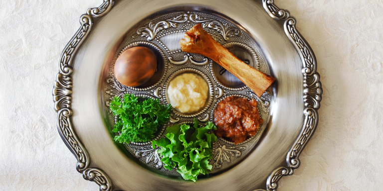 silver seder plate with egg, parsley, shakbone, charoset