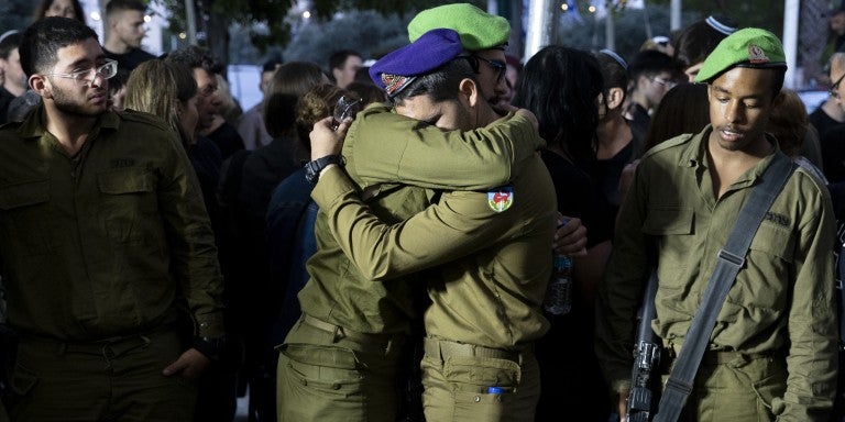 Soldiers mourn during a funeral for IDF soldier Sergeant Michael Ruzal Killed in a rocket attack in Southern Israel on May 6, 2024 in Rishon LeZion, Israel. 