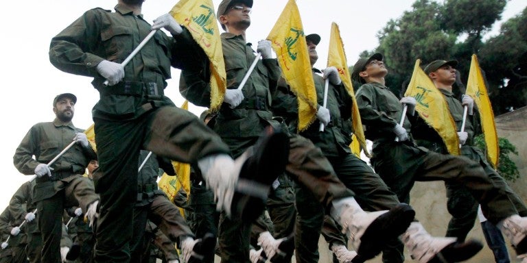 Photo of Hezbollah marching with flags