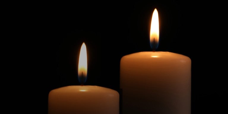 2 Candles on a black background