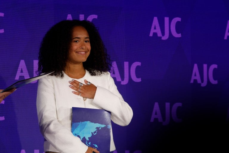 Image of Noa Fay accepting AJC's Sharon Greene Award for Campus Advocacy at AJC's 2024 Global Forum