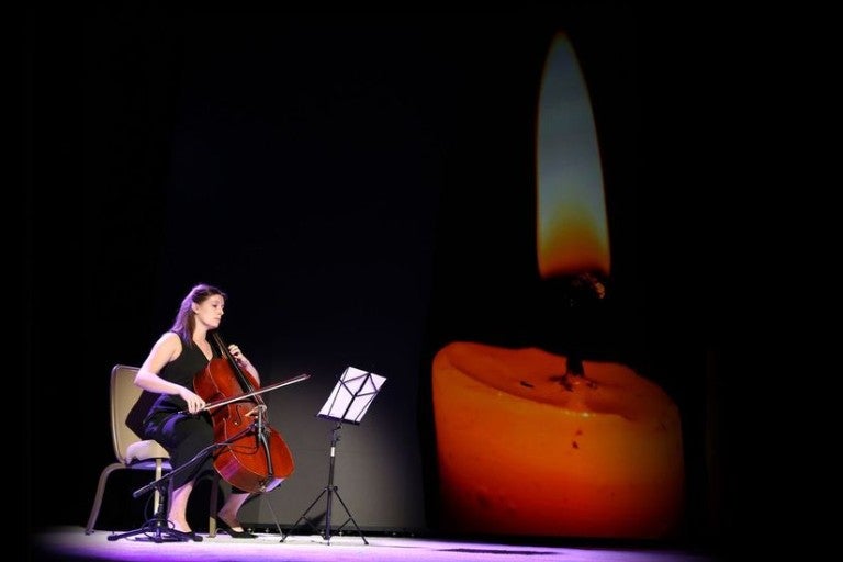 Image of woman playing violin as AJC Pays Tribute to the Victims of the October 7 Hamas Massacre
