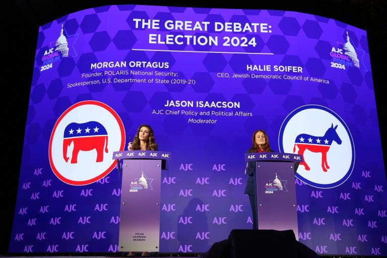 Photo of Morgan Ortagus and Halie Soifer at AJC Global Forum behind podiums for The Great Debate: Election 2024