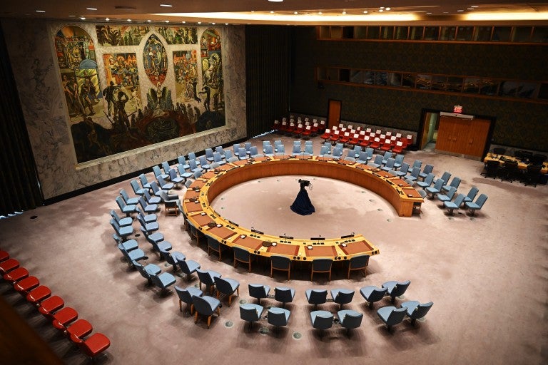 UN Securty Council Chamber with empty chairs and circular table
