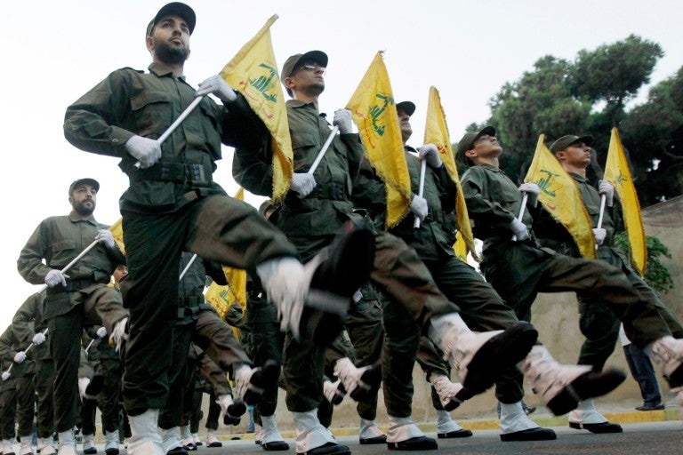 Photo of Hezbollah marching with flags