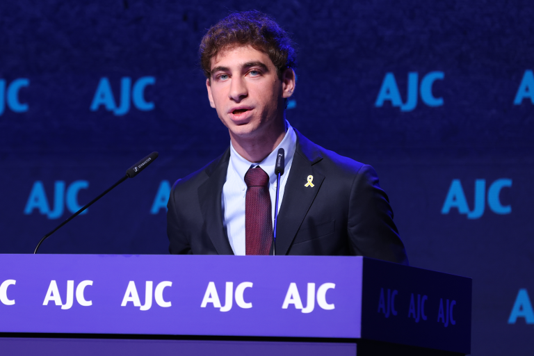 Photo of Ben Messafi receiving AJC's Sharon Greene Award