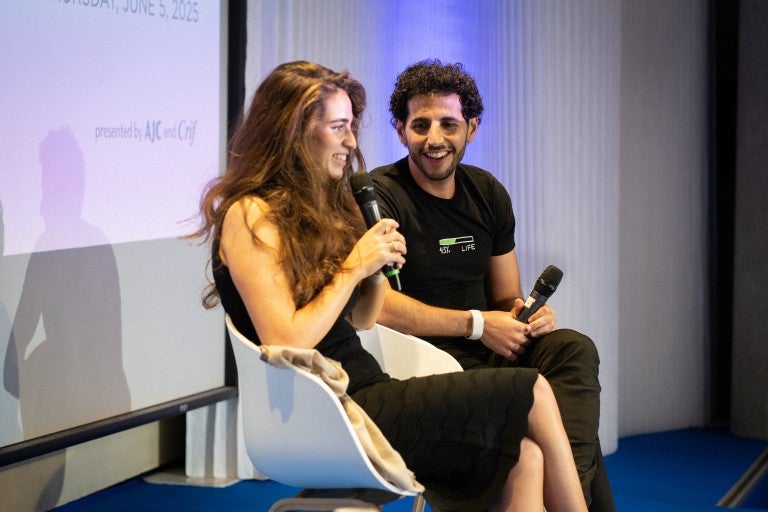 Aija Mayrock and Nas Daily speaking at the AJC - CRIF Paris Forum