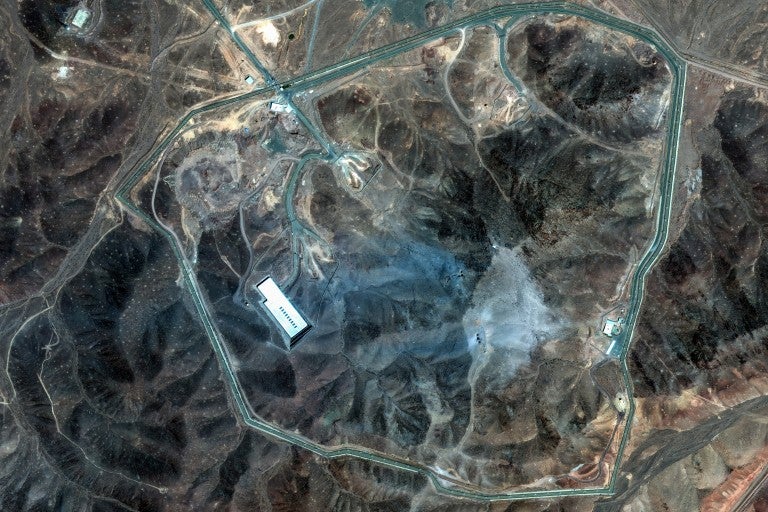 Extensive Damage at Fordow Underground Complex After Airstrikes FORDOW UNDERGROUND COMPLEX, IRAN -- JUNE 22, 2025: 02 Maxar Satellite Imagery collected this morning shows extensive damage at the Fordow underground complex. Several large craters are visible across the ridge, and a wide area is covered in grey-blue ash, consistent with airstrike aftermath.