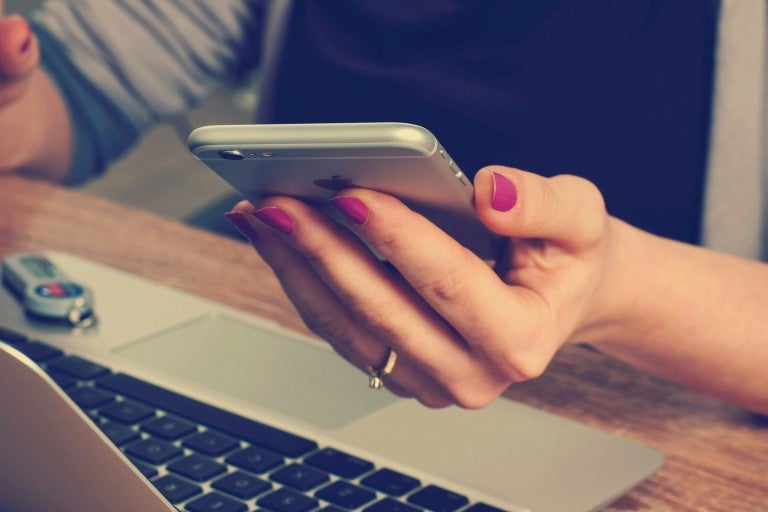 Photo of someone holding an iPhone