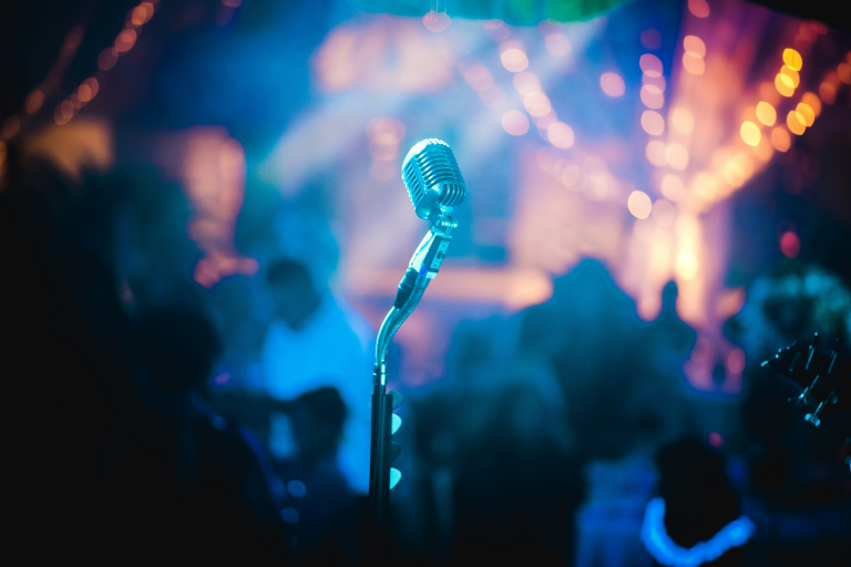 Photo of a microphone on a stage.