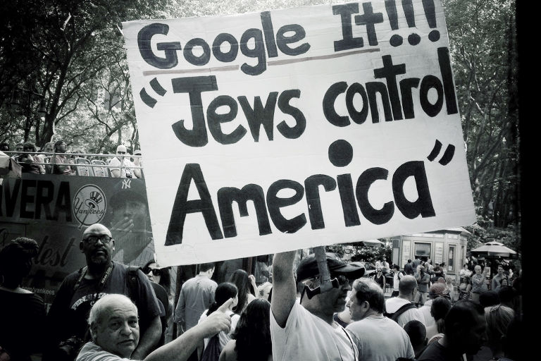 Photo of a sign saying "Google It!!! 'Jews control America"