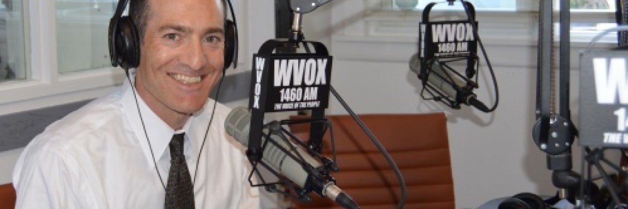 Photo of Scott Richman in the WVOX radio studio