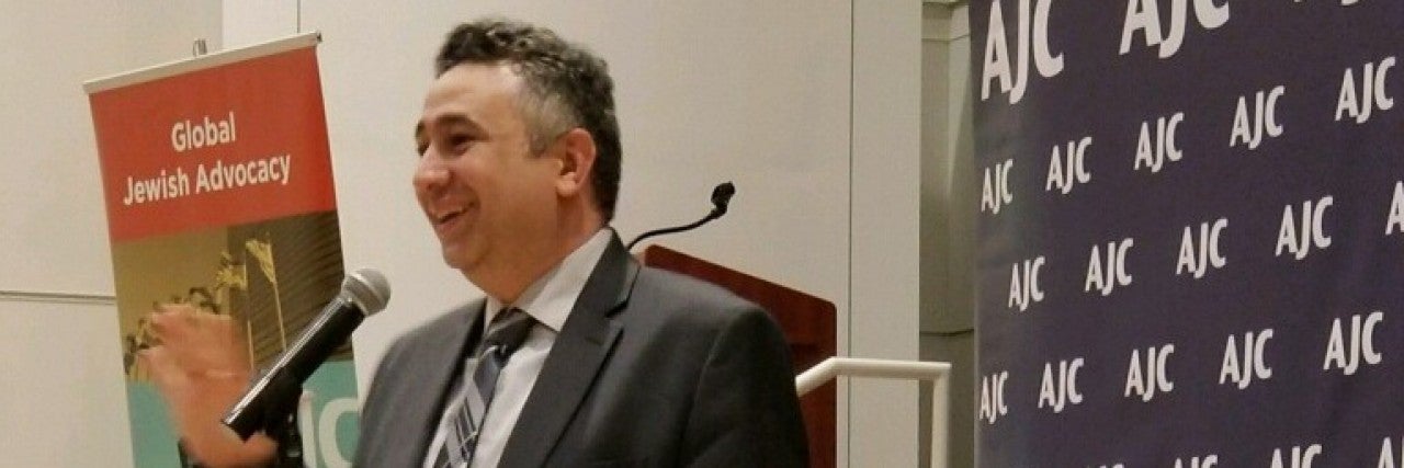 Photo of Shadi Martini speaking at AJC Seattle event