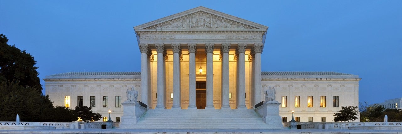 Photo of the Supreme Court at dusk