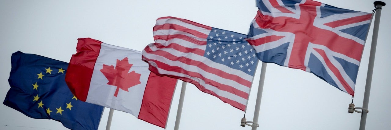 Flags of the EU, Canada, the U.S., and the UK
