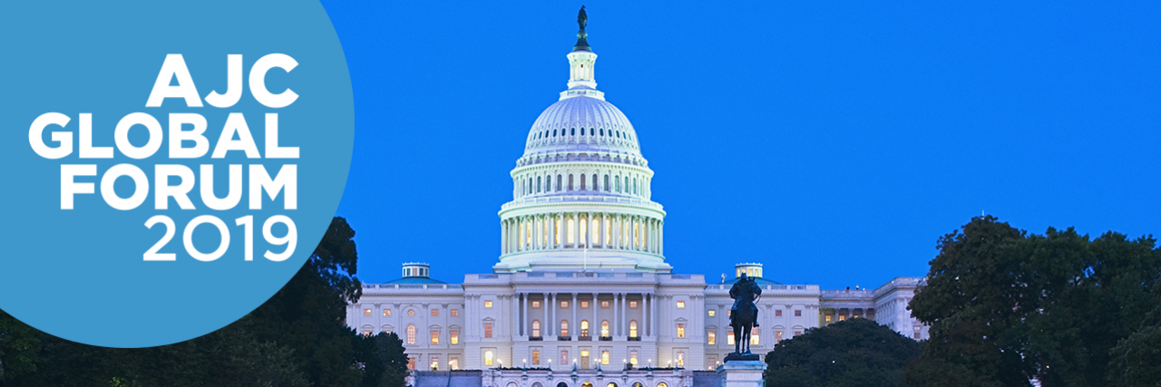 Photo of U.S. Capitol at night with AJC Global Forum 2019 text