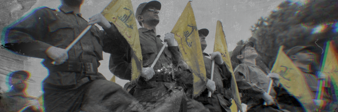 photo of Hezbollah militants marching with flags
