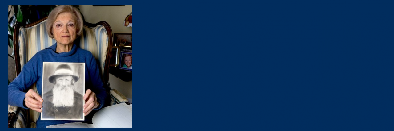 Toby Levy holding a picture of her father