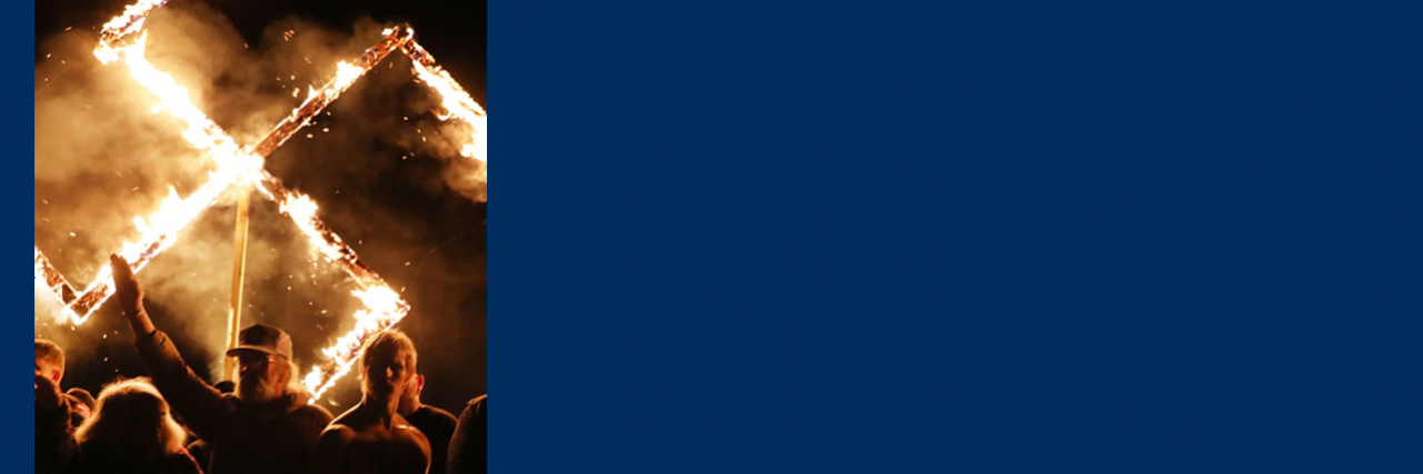 Far-right rally with flaming swastika