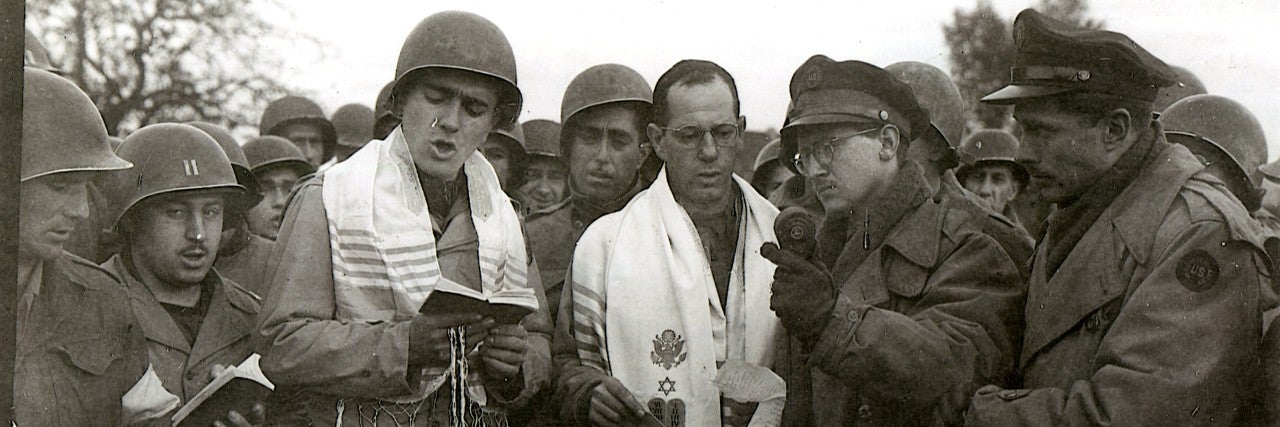  Chaplain Sidney Lefkowitz, PFC Max Fuchs, acting cantor, and soldiers in 1944 for NBC Radio Broadcast at Aachen, Germany battlefield