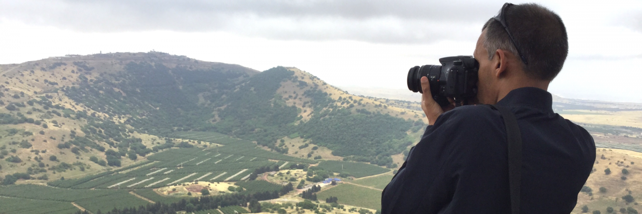 A photo of a journalist taking a photo on a Project Interchange delegation