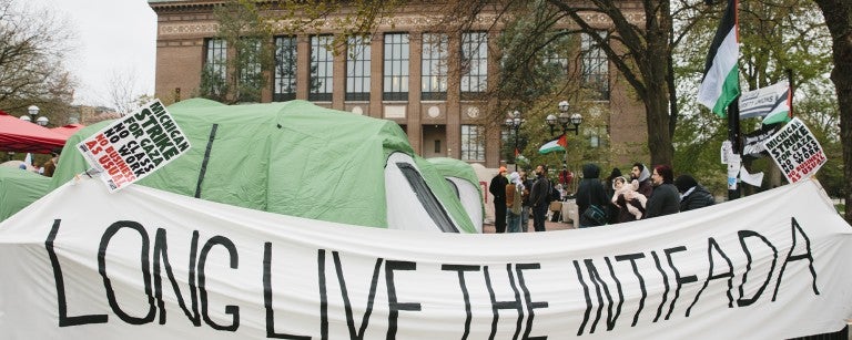 Encampment at Columbia with a "Long Live the Intifada" sign