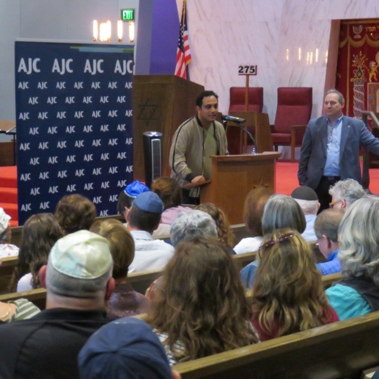 Photo of Mohammed Al Samawi speaking at AJC Seattle event