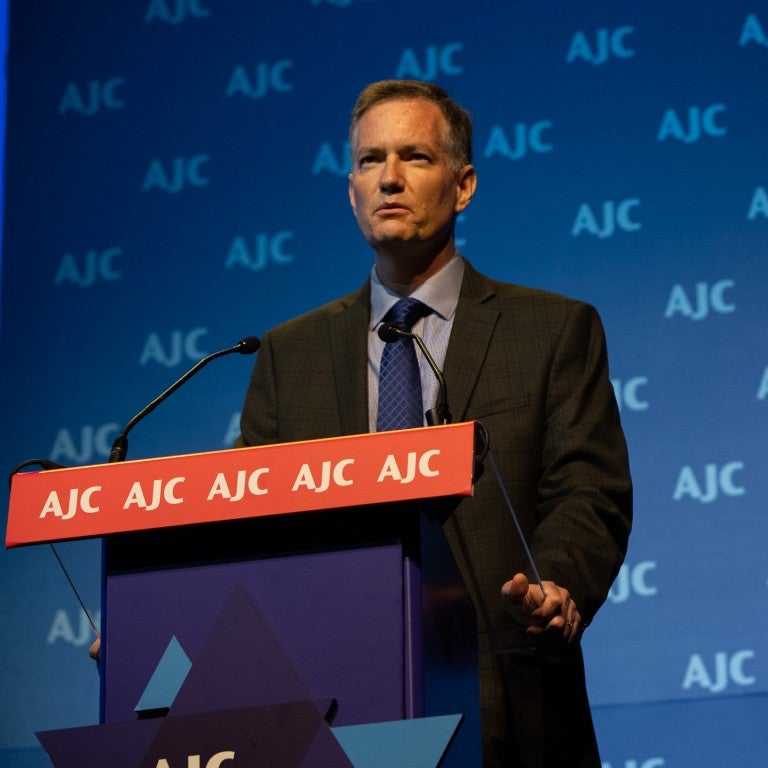 Photo of Dr. Kurt Graham speaking at AJC Global Forum 2018