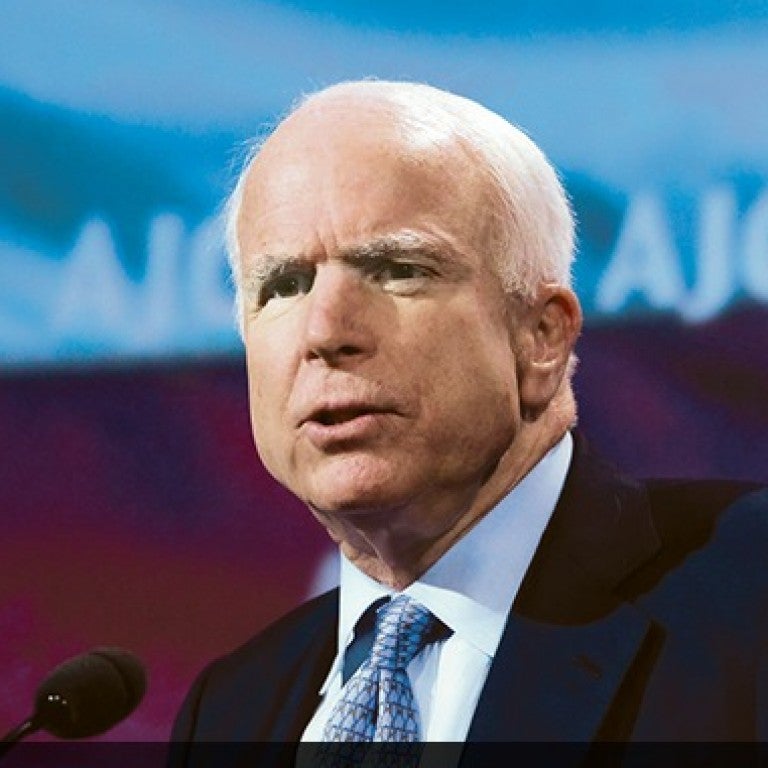 Photo of Senator John McCain speaking at AJC Global Forum
