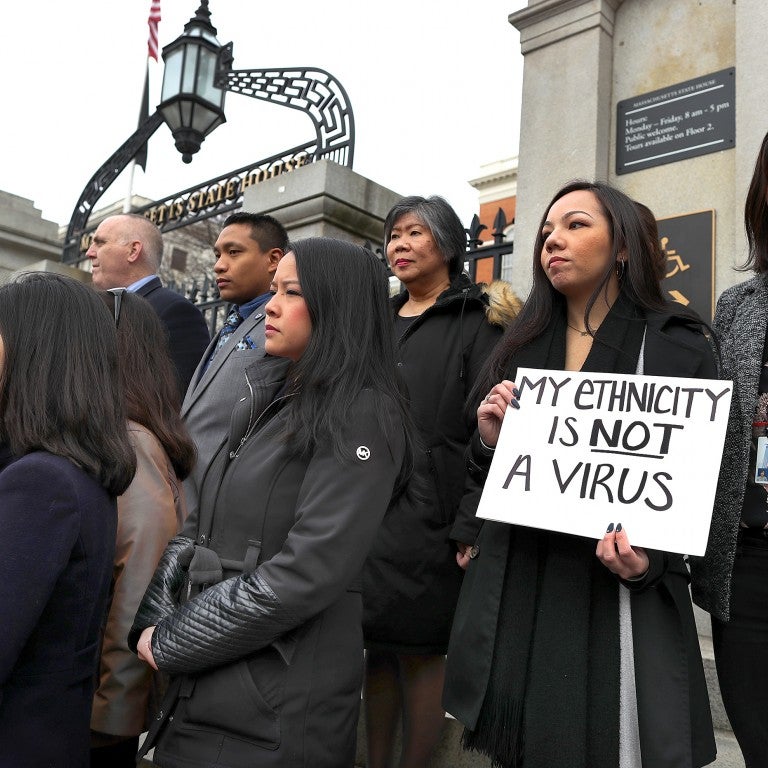 Members of the Asian American Commission hold a press conference on the steps of the Massachusetts State House to condemn racism towards the Asian American community because of coronavirus on March 12, 2020 in B