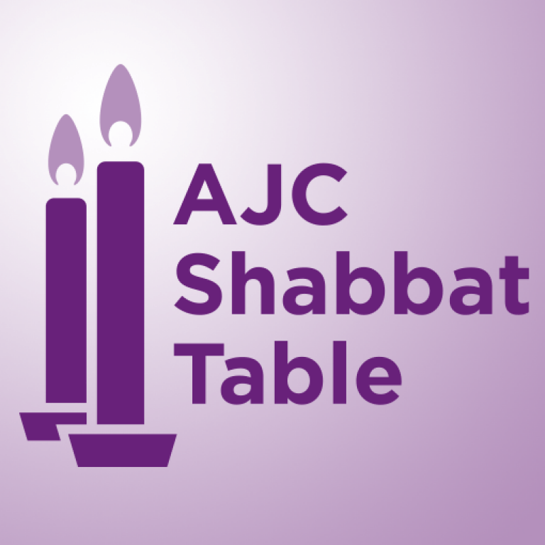 2 candlesticks on a light purple background with the words AJC Shabbat Table