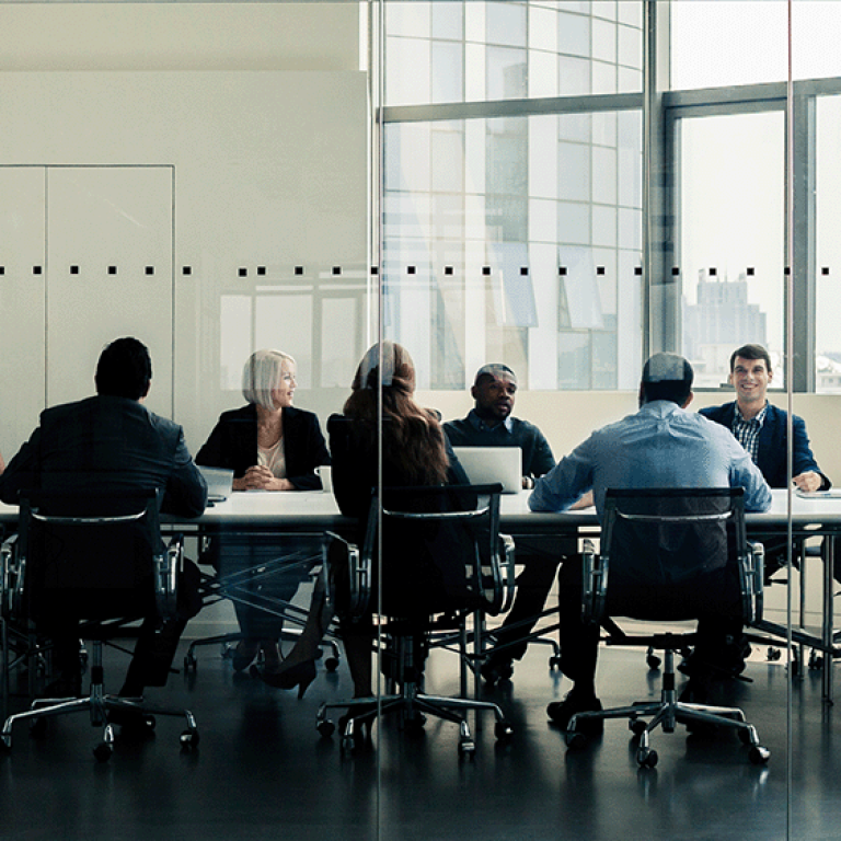 People sitting around a table in a conference room