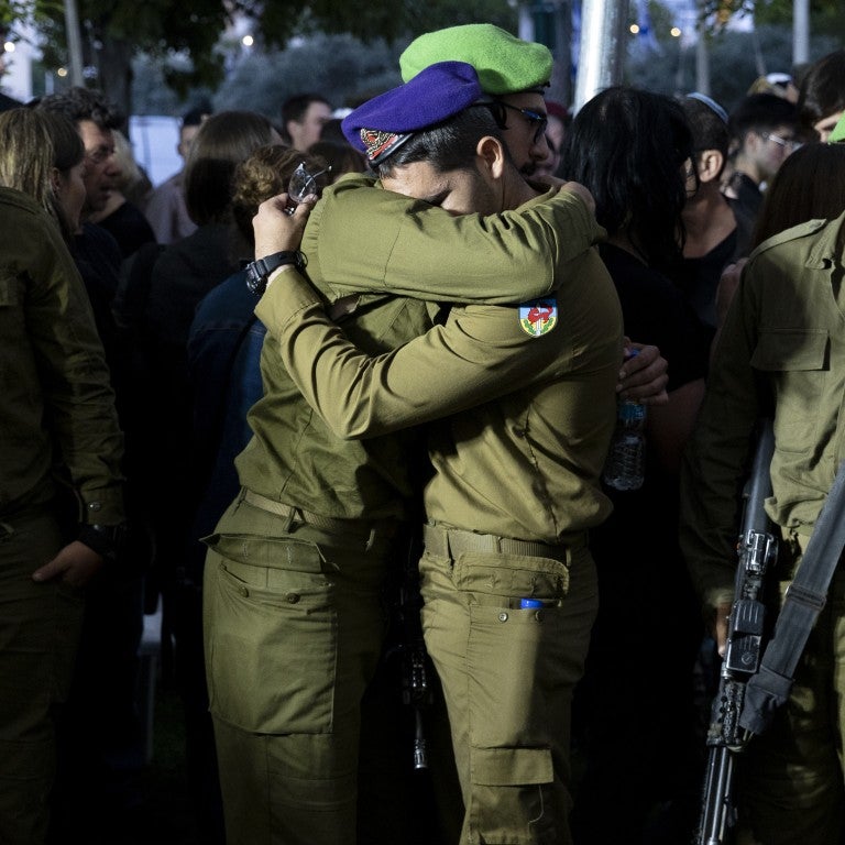 Soldiers mourn during a funeral for IDF soldier Sergeant Michael Ruzal Killed in a rocket attack in Southern Israel on May 6, 2024 in Rishon LeZion, Israel. 