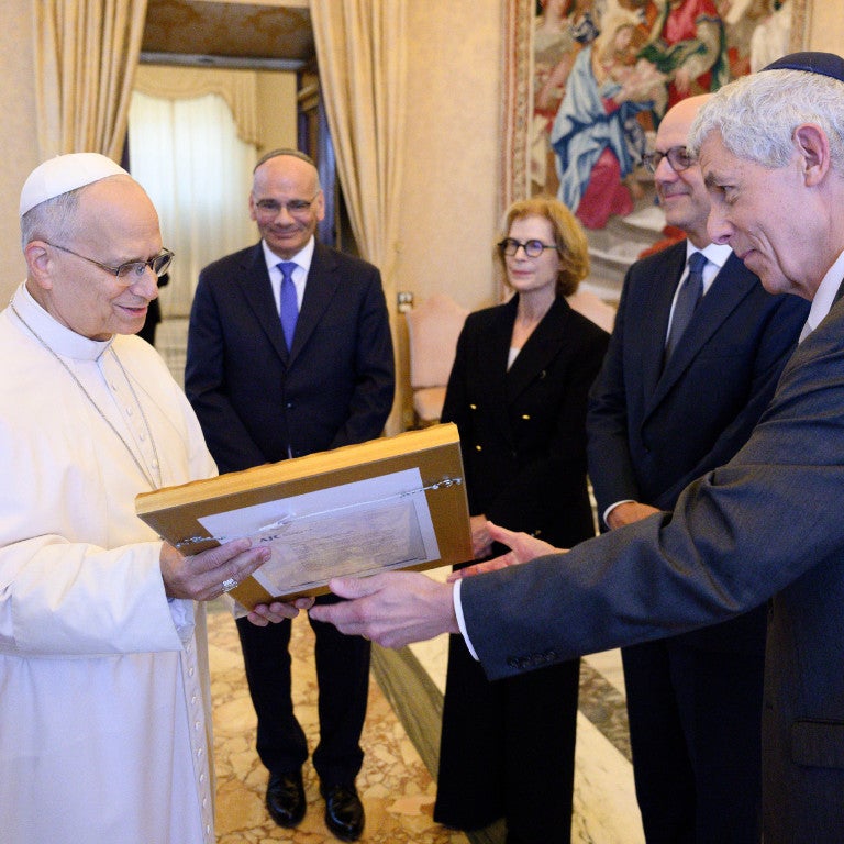 AJC President Bobby Lapin, CEO Ted Deutch, and Director of Interreligious Affairs Rabbi Noam Marans presenting artwork commissioned by AJC to Pope Leo XIV