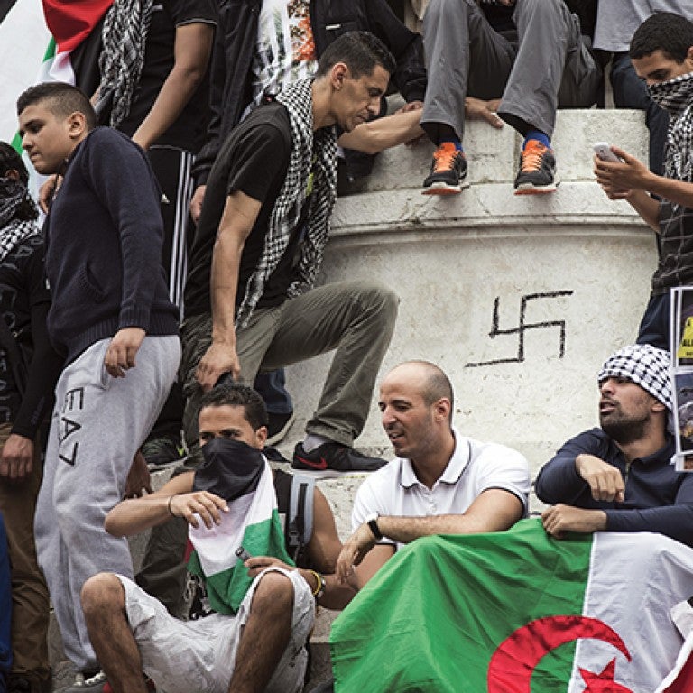 Photo from a protest in France with a Swastika graffiti-ed on a monument