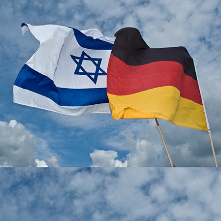 Image of overlapping Israeli and German flags